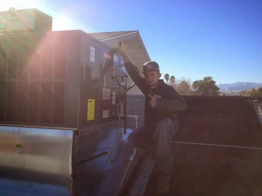 HVAC technician performing HVAC Inspection on a rooftop unit in Canal Winchester